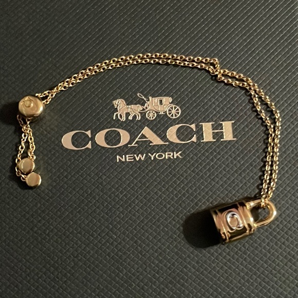 Coach Accessories - Coach lock two tone slider bracelet. Gold and silver